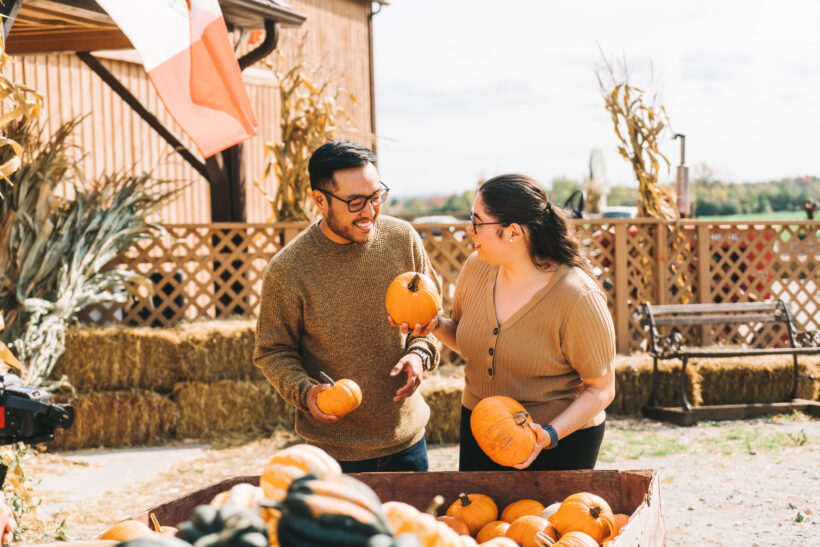 A couple picking pumpkins at Andrew's Farm and Winery