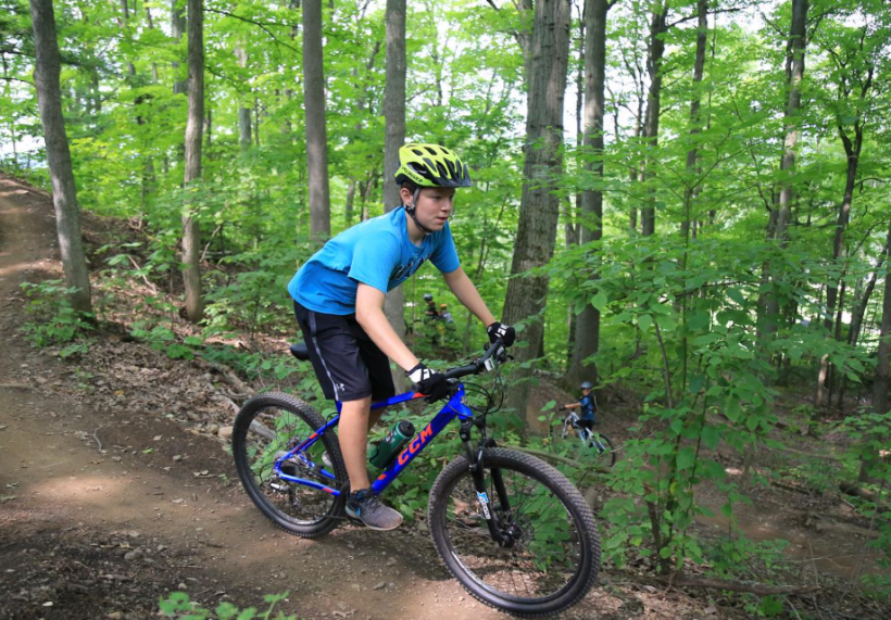 a child biking through Kelso Conservation Area