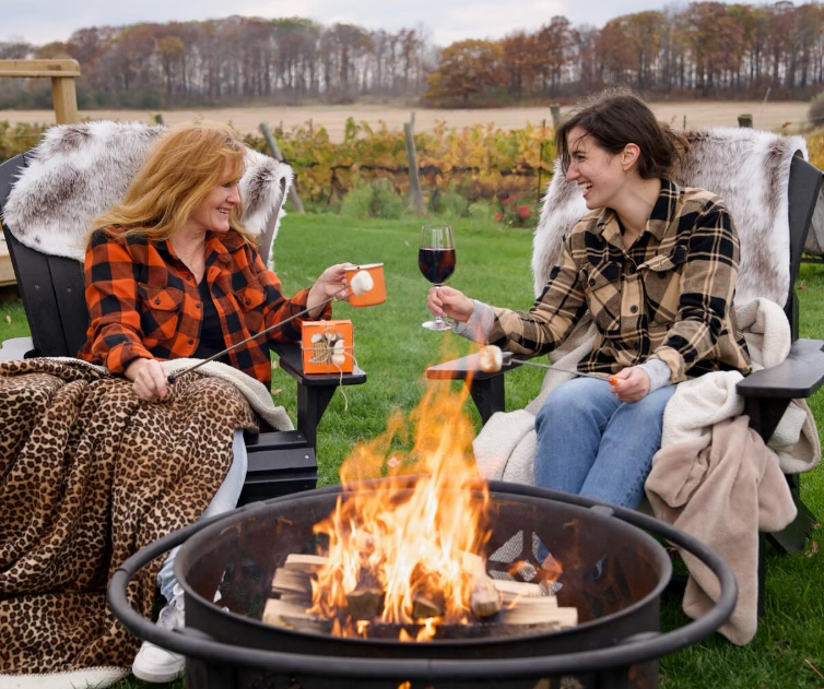 friends enjoying the fire pit experience at ridge road winery